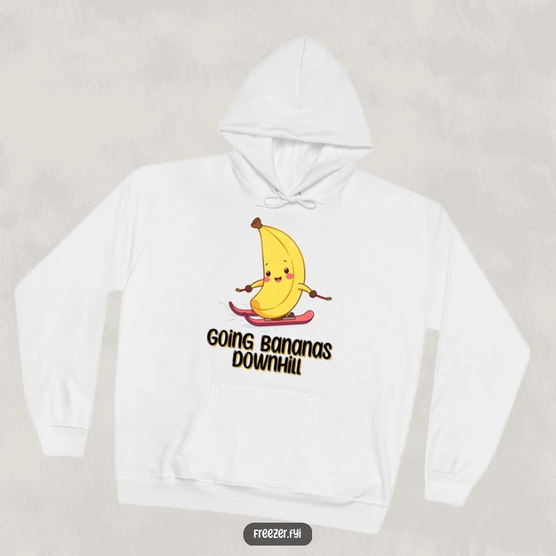 Funny hoodie designed with a laughing banana peel on skis, zipping down a frosty slope, perfect for cozying up after winter adventures.
